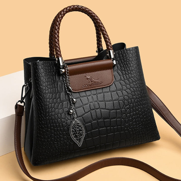 Elegant women's genuine leather handbag. Versatile shoulder/crossbody purse with designer style for daily fashion.
