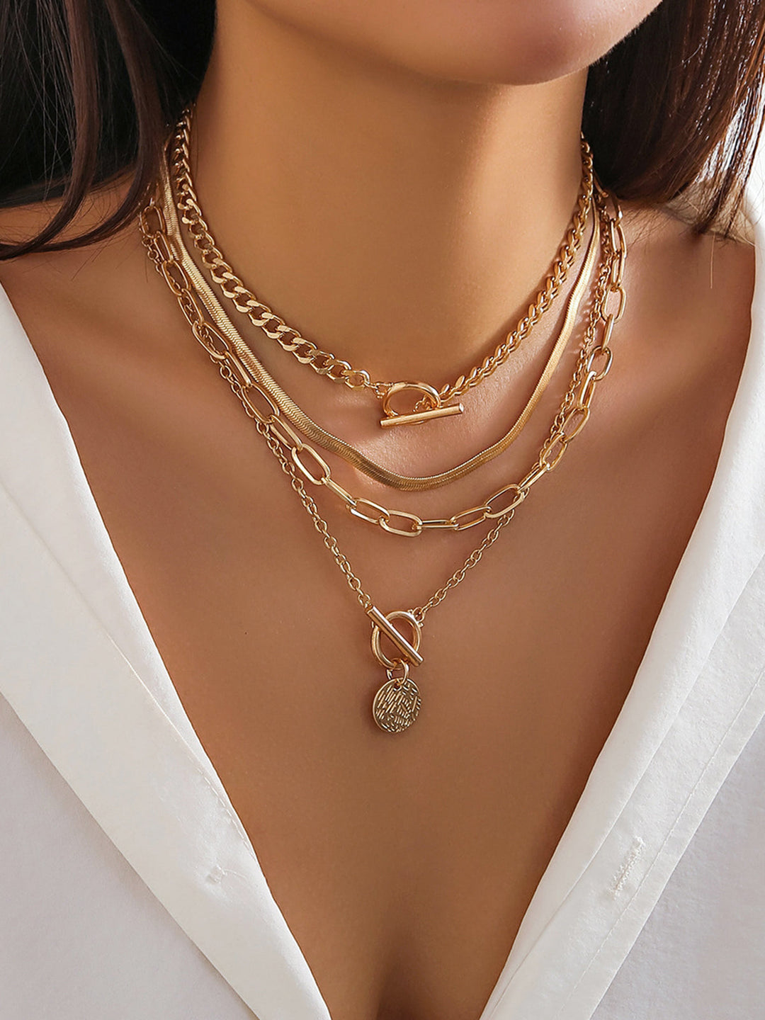 Elegant women's gold layered necklace set with multiple chains & a stylish coin pendant. Perfect fashion jewelry.