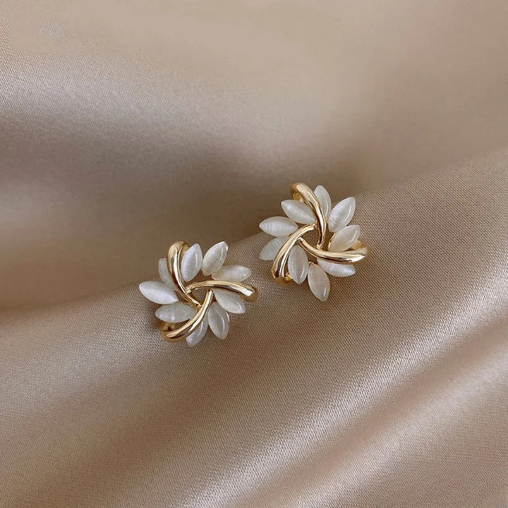 Elegant women's gold opal flower dangle earrings with a sophisticated floral design. Perfect jewelry gift for her.