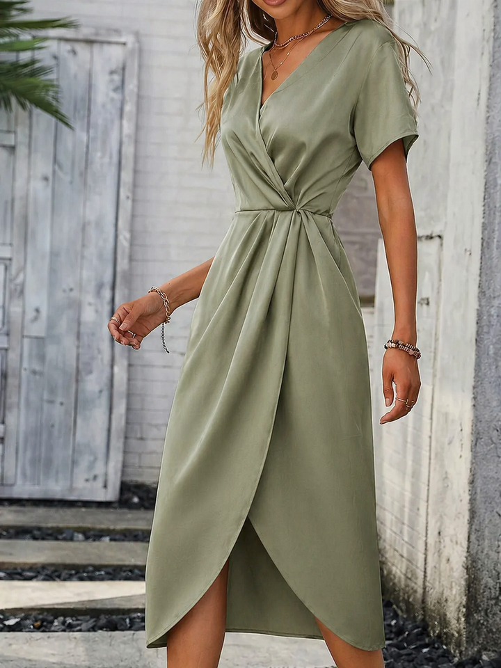 Classic green women's wrap midi dress, featuring short sleeves and a flattering fit for summer elegance.