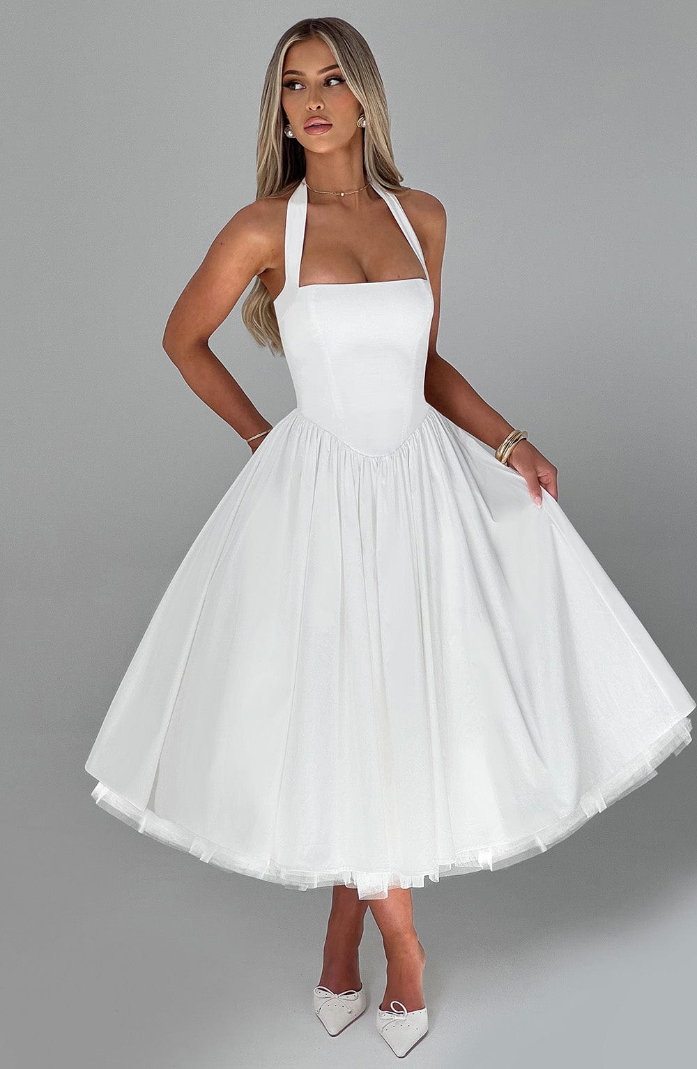 Women's formal halter midi dress, an elegant and flattering choice for any special occasion or party.