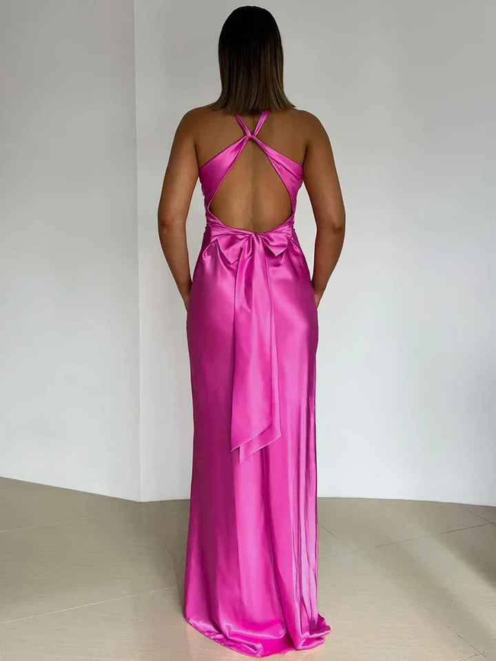 Stunning women's elegant satin maxi evening gown with a flattering halter neck design for special occasions.