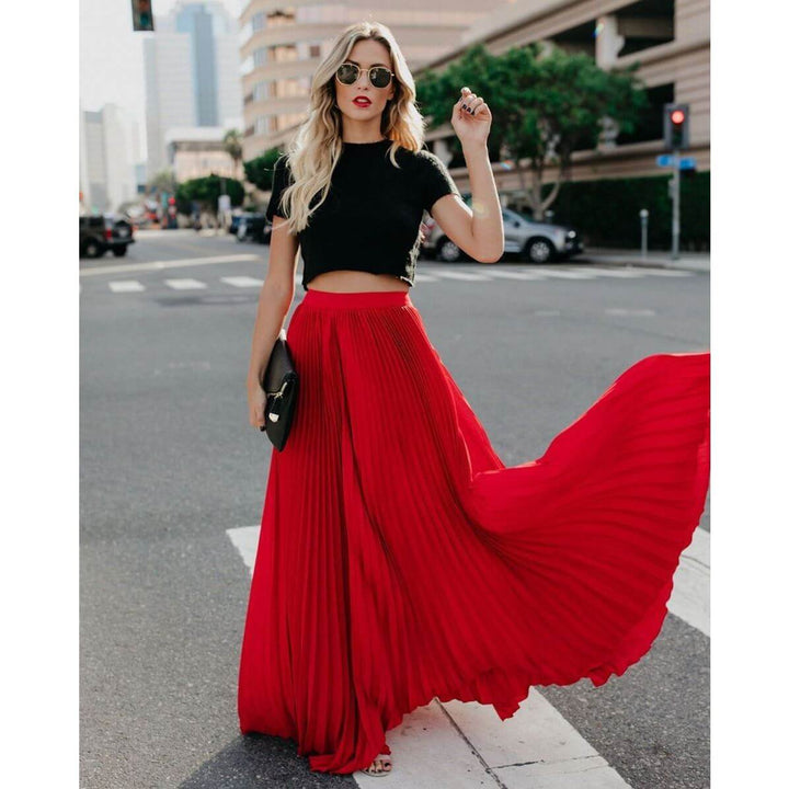 Elegant women's high waist pleated maxi skirt in a beautiful flowy fabric, perfect for chic versatile style.