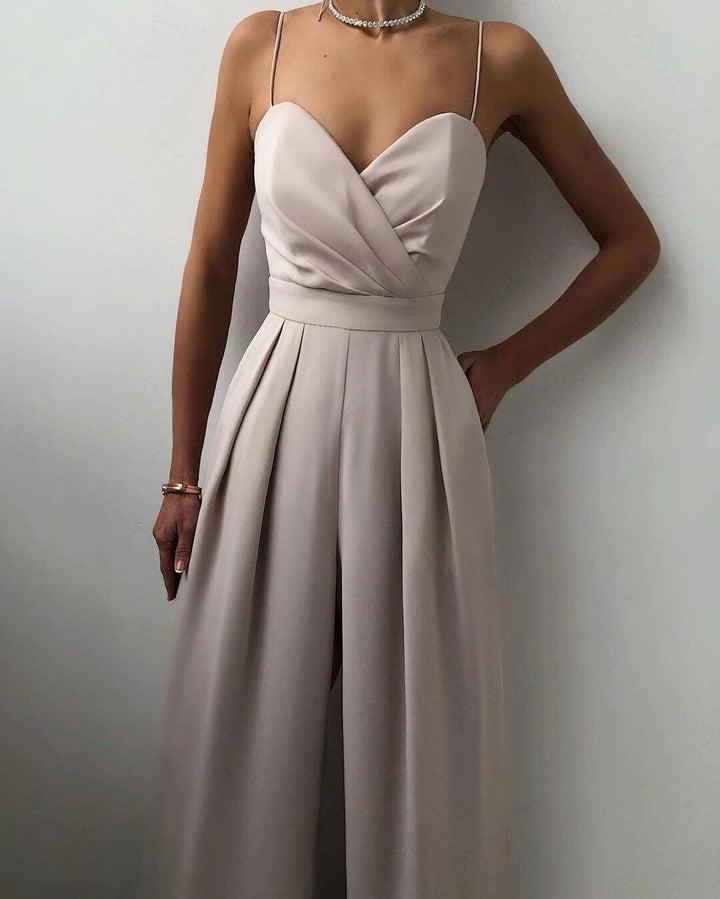 Front view of a women's high-waist spaghetti strap jumpsuit. Sophisticated party wear and summer fashion.