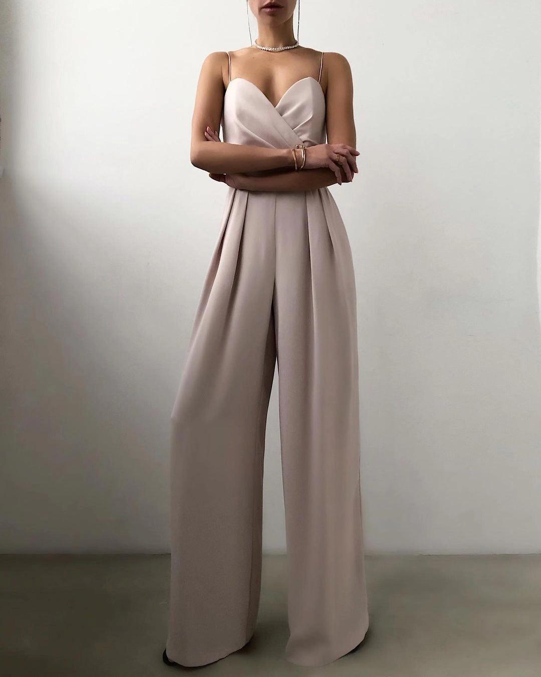 Close-up of the elegant high-waist and spaghetti straps on a women's chic jumpsuit.