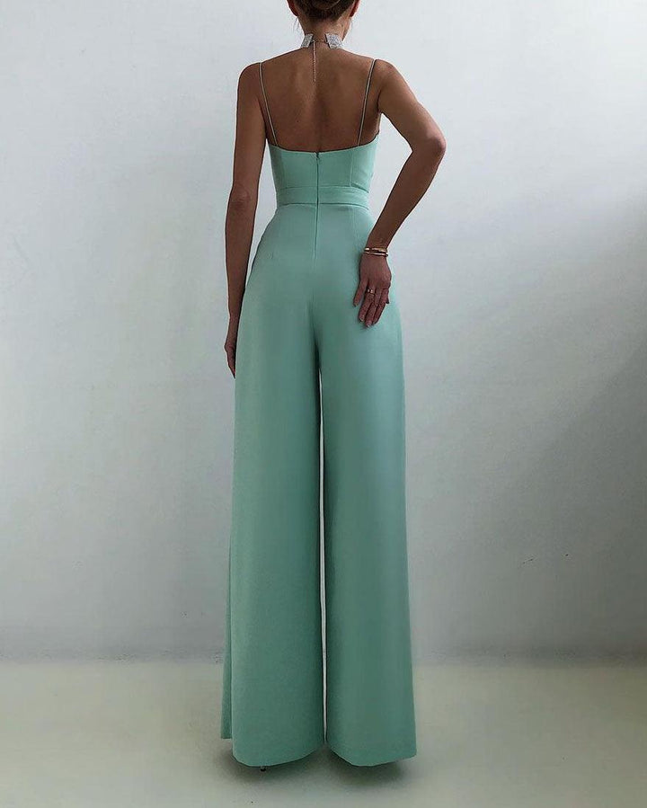 Flowy women's elegant high-waist jumpsuit with spaghetti straps. Perfect for summer and versatile styling.