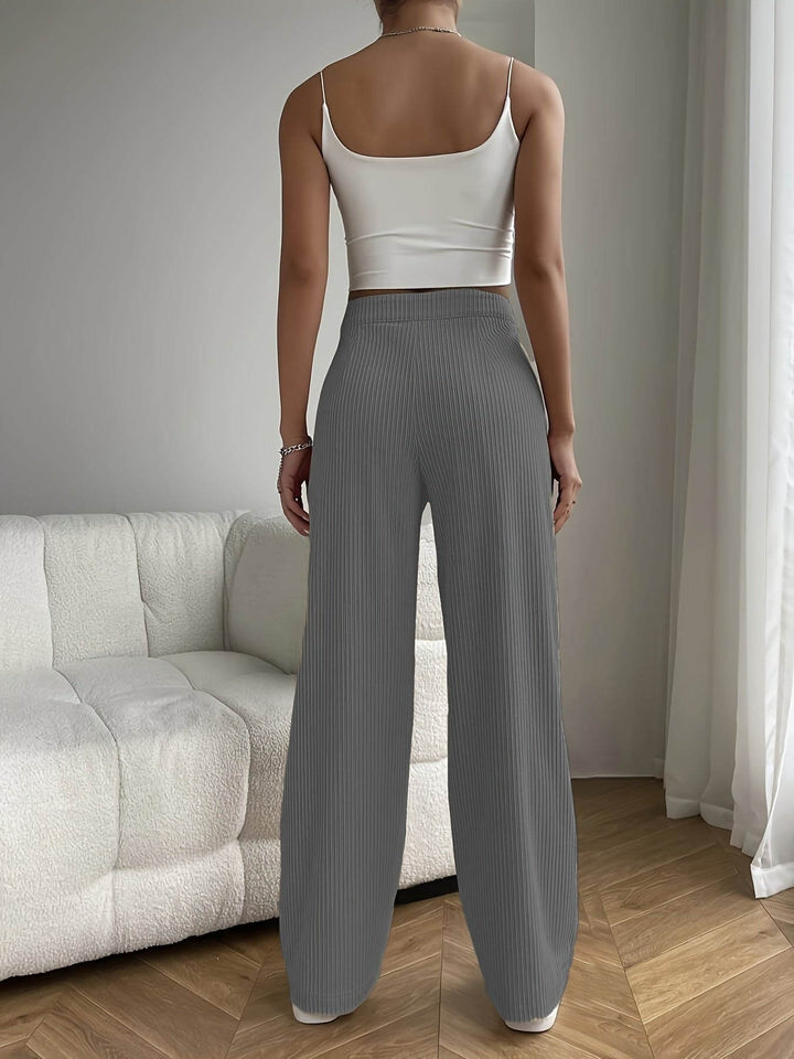 Flattering women's high waist wide leg trousers, designed for an elegant silhouette and comfortable modern style.