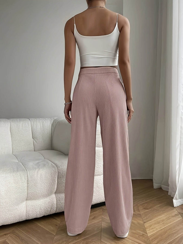 Chic women's high waist wide leg trousers, offering comfortable fashion with a modern, elegant, and versatile design.
