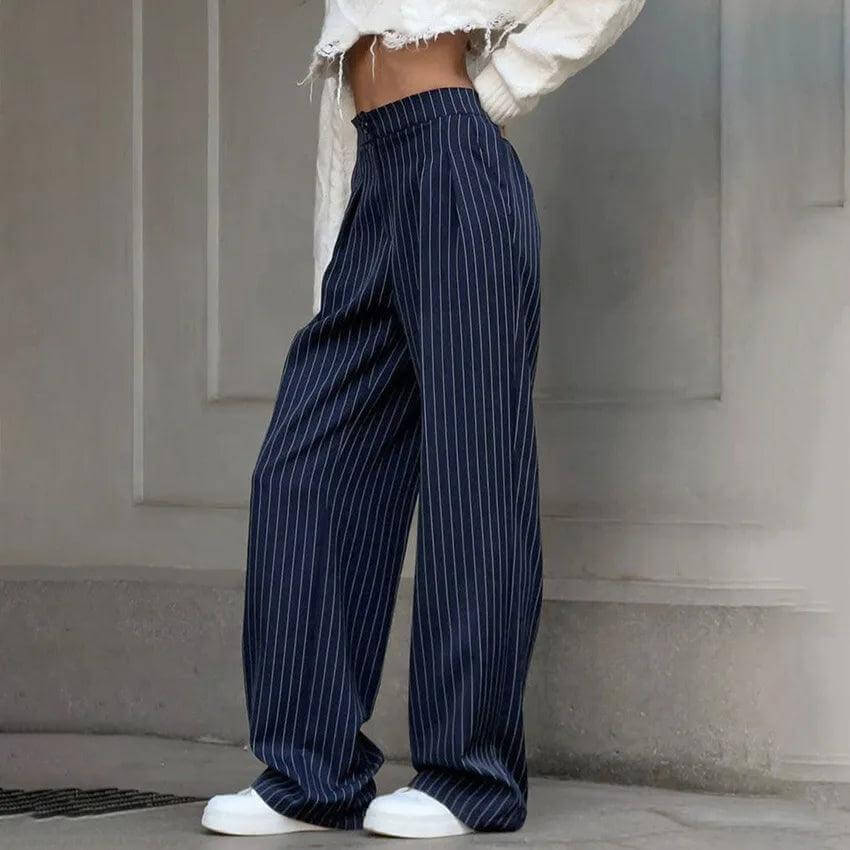 Stylish navy blue high-waisted striped trousers for women, showcasing a flattering fit & modern design. Casual or formal.