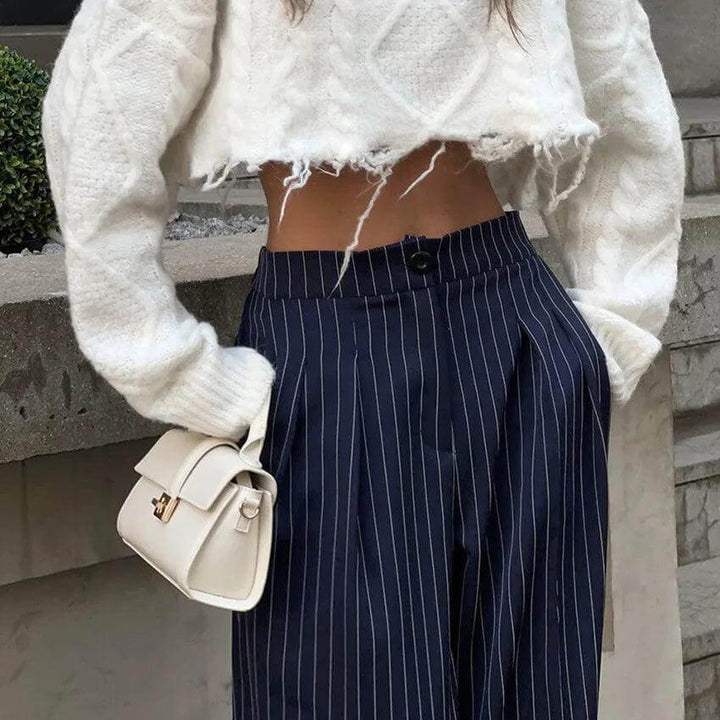 Fashionable women's high-waisted striped trousers, blending elegance with comfort for everyday wear or special events.