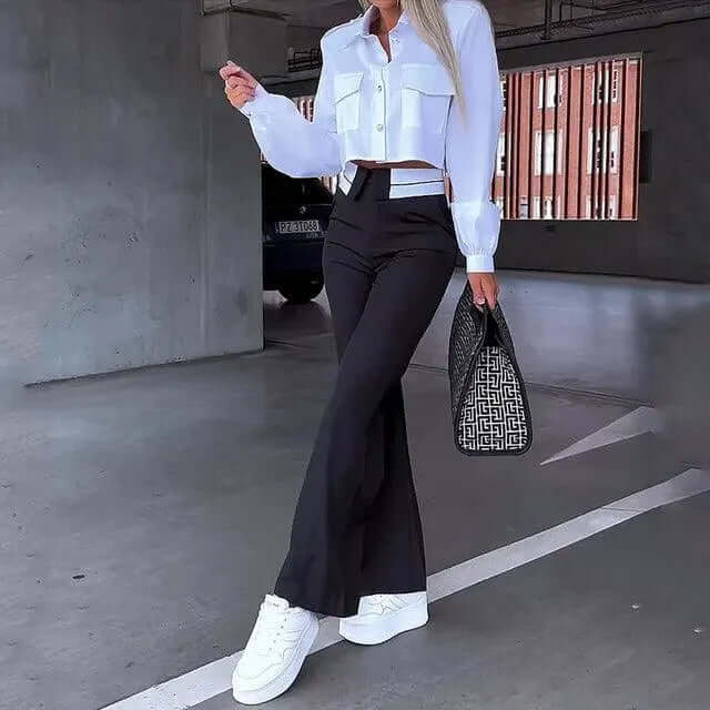 Comfortable black high-waisted wide-leg women's trousers, versatile for fashion-forward casual or elegant outfits.
