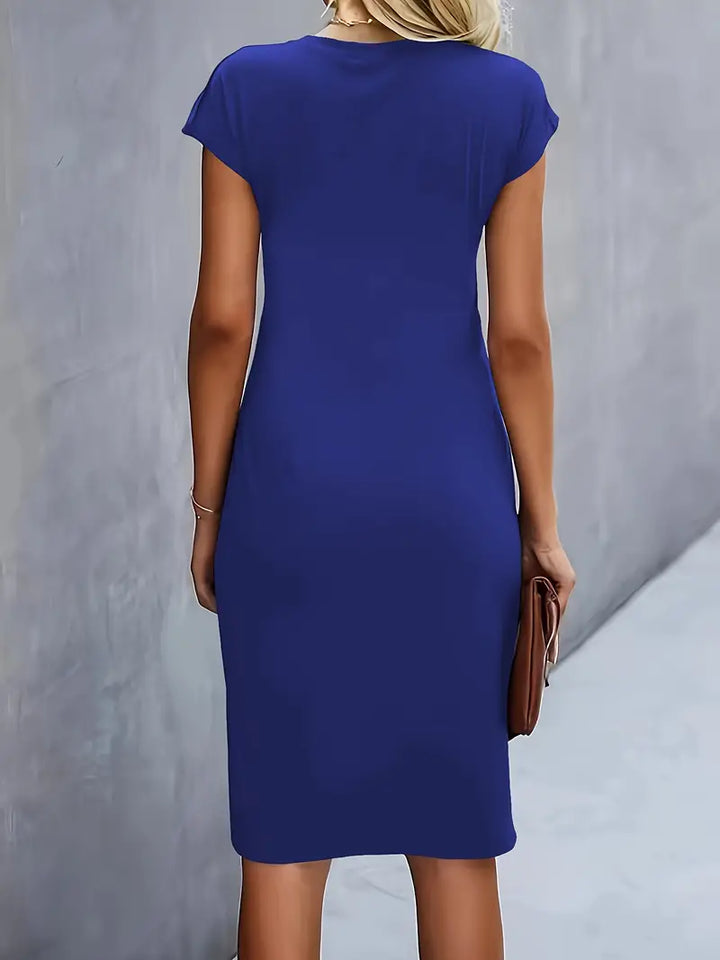 Beautiful women's knee-length sheath dress with a stylish ruched waist, ideal for evening events.