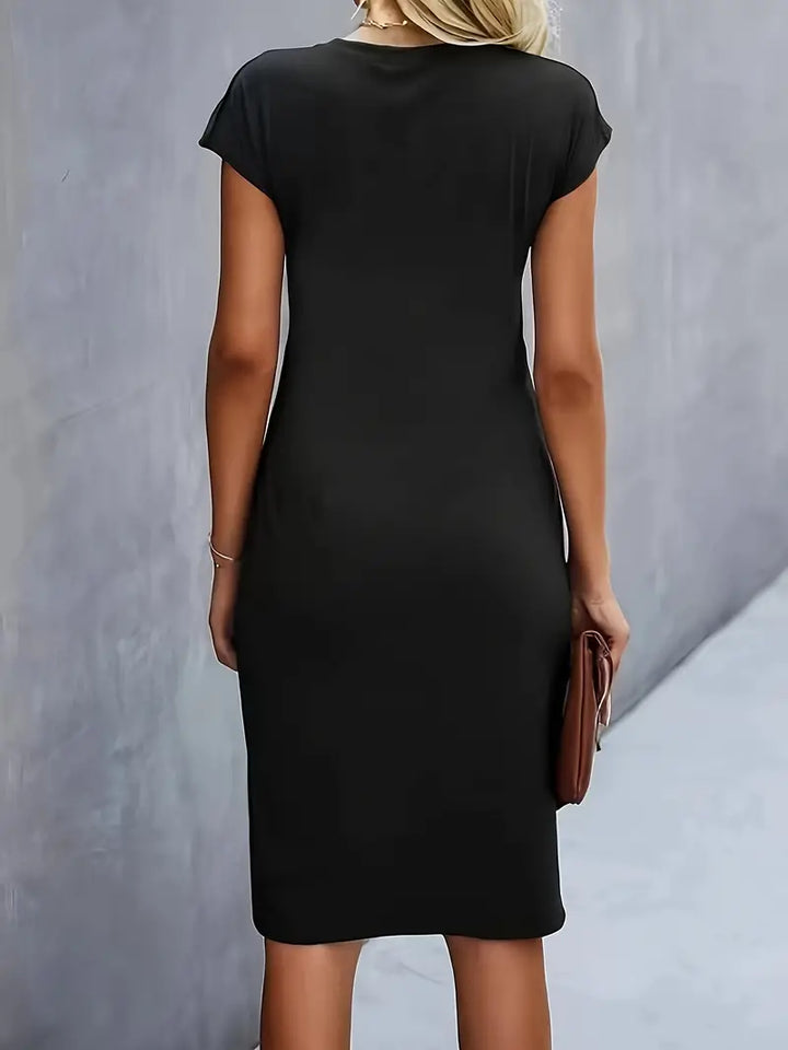 Sophisticated women's solid color sheath dress, knee-length, featuring a stylish ruched waist detail.