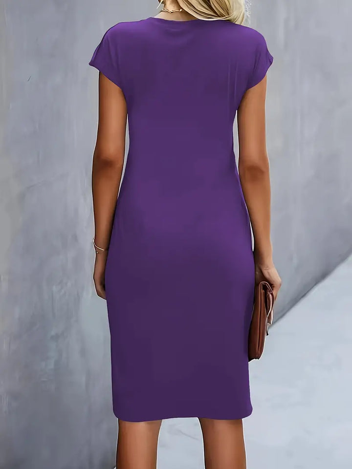 Sophisticated women's sheath dress, knee-length, ruched waist detail, perfect for elegant gatherings.