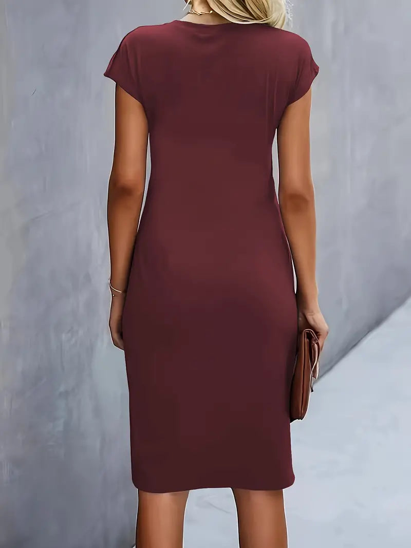 Elegant women's knee-length sheath dress with a tailored ruched waist, suitable for work and parties.