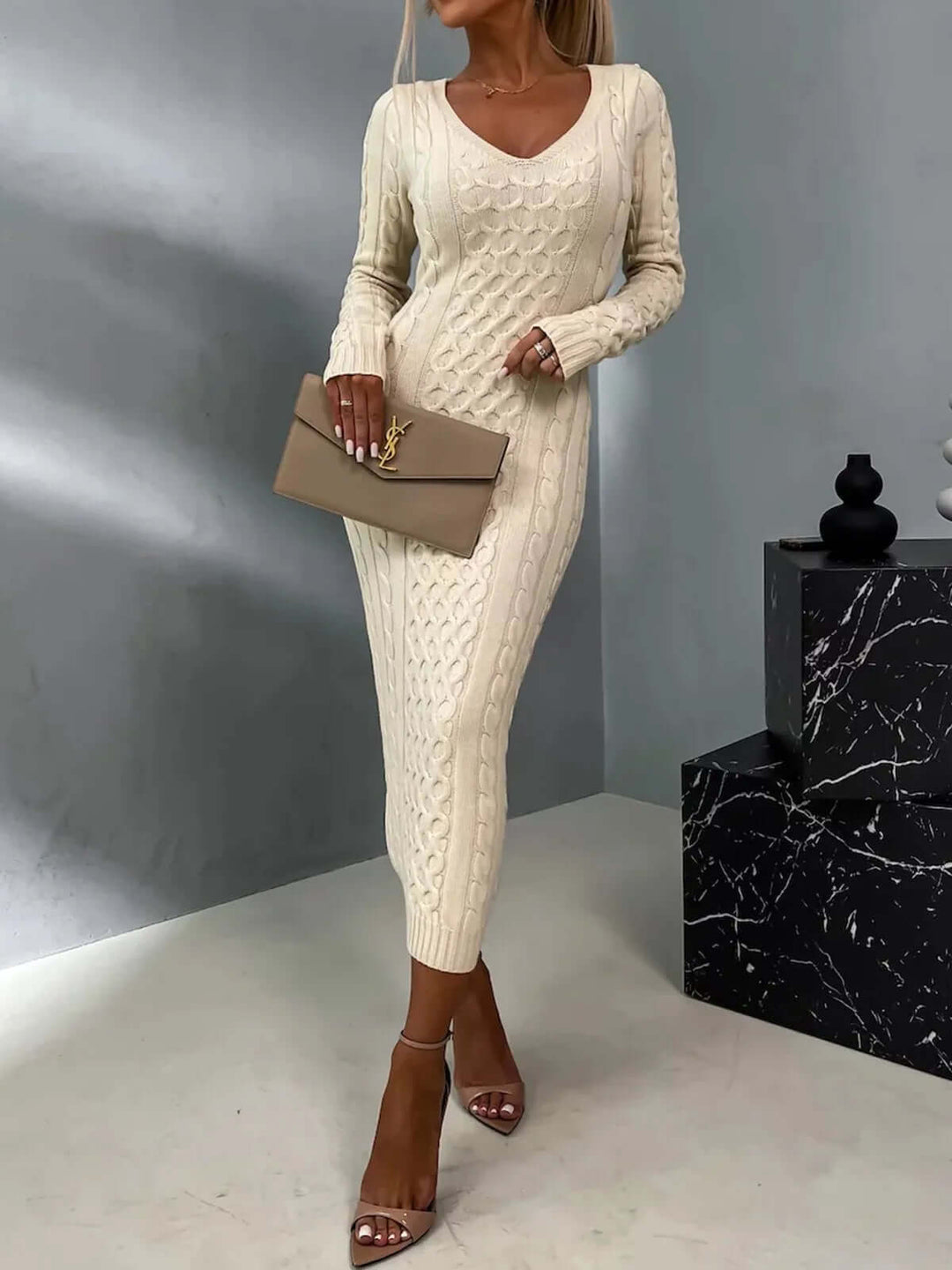 Elegant women's knitted dress with delicate lace back, perfect for versatile fashion and comfort.