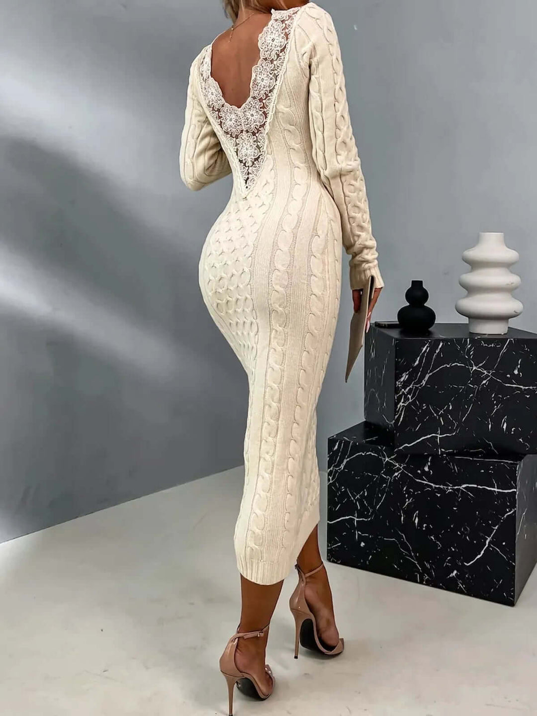 Comfortable polyester viscose knitted dress for women, featuring a delicate lace back detail for elegant style.