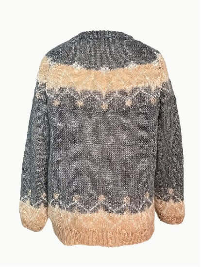 High-quality women's knitted round neck sweater. Elegant cozy long sleeve top for winter.