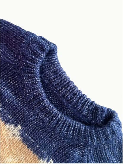 Beautifully knitted women's round neck sweater, elegant long sleeve top for cozy winter.