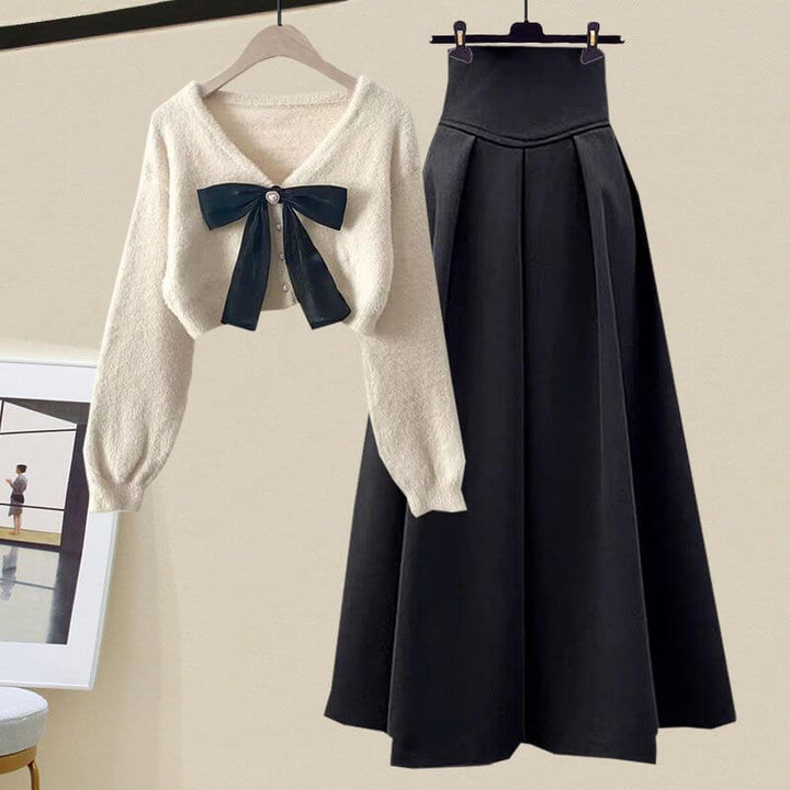 Women's elegant knitted sweater & pleated midi skirt set. Versatile fall & winter fashion outfit.