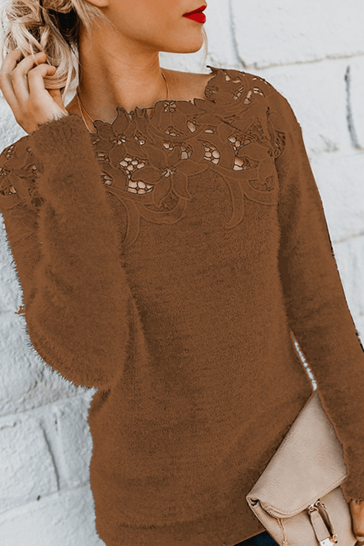Women's soft knit sweater top with intricate lace detail, providing an elegant and warm winter look.