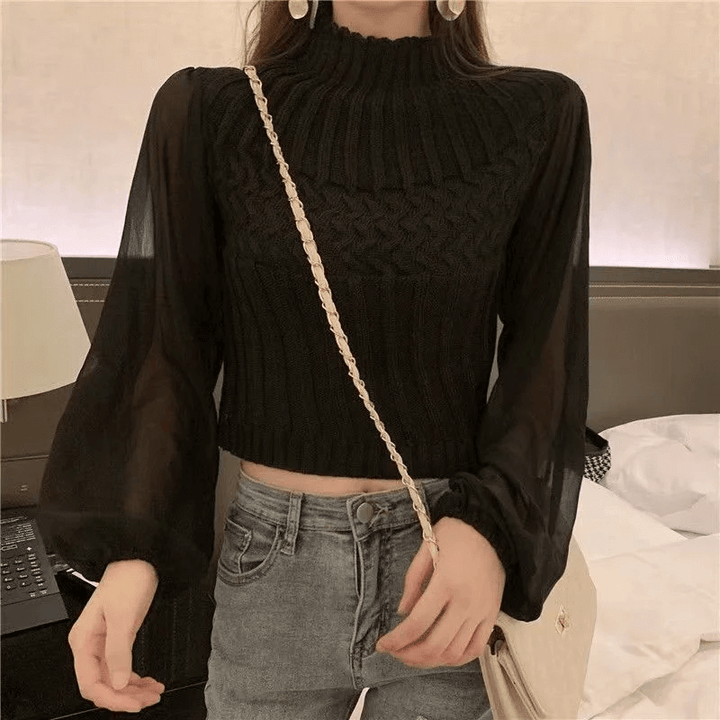 Chic women's autumn wear: a comfortable knitted vest with stylish sheer sleeves.