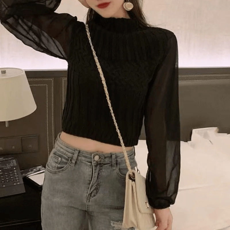 Elegant women's knitted vest, featuring flowy sheer sleeves for a sophisticated look.