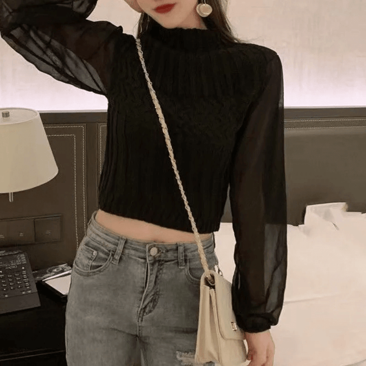 Elegant women's knitted vest, featuring flowy sheer sleeves for a sophisticated look.