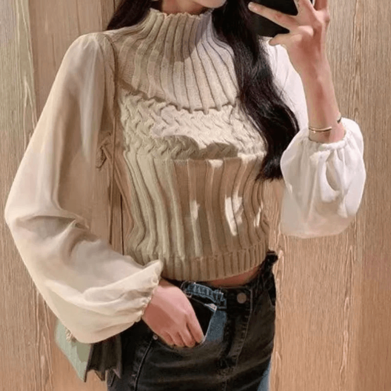 Sophisticated women's knitted vest with sheer sleeves, a timeless autumn fashion piece.