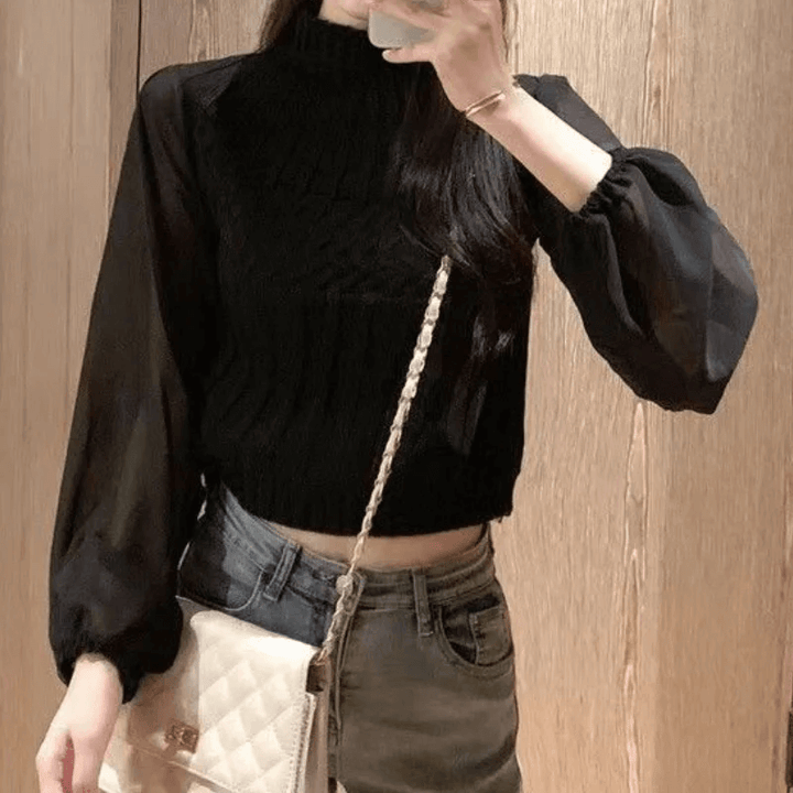 Chic women's knitted vest featuring stylish sheer sleeves for versatile layering.