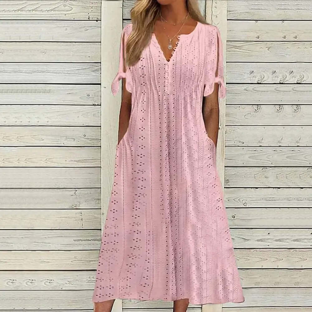 Elegant women's lace midi dress with delicate detailing, perfect for summer parties or sophisticated casual wear.