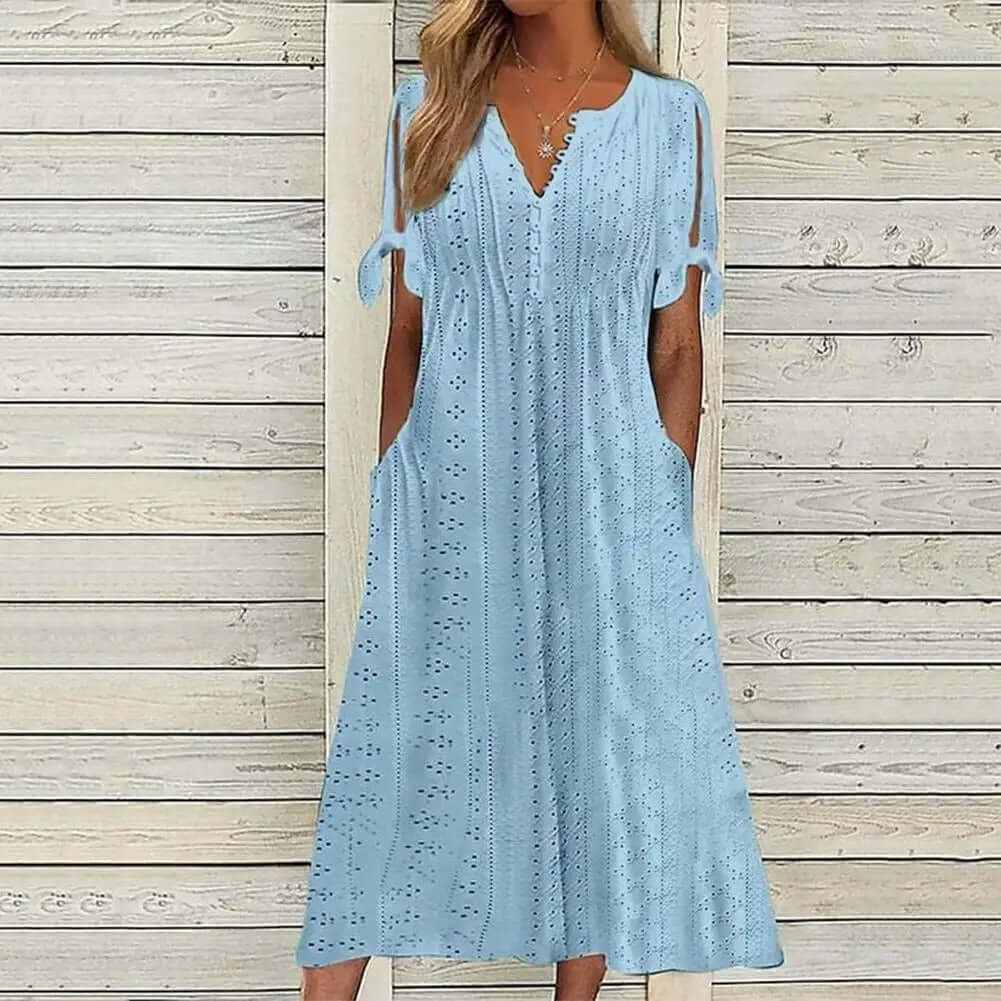 Breathable women's summer midi dress, featuring a flattering V-neck and beautiful lace, ideal for warm weather fashion.