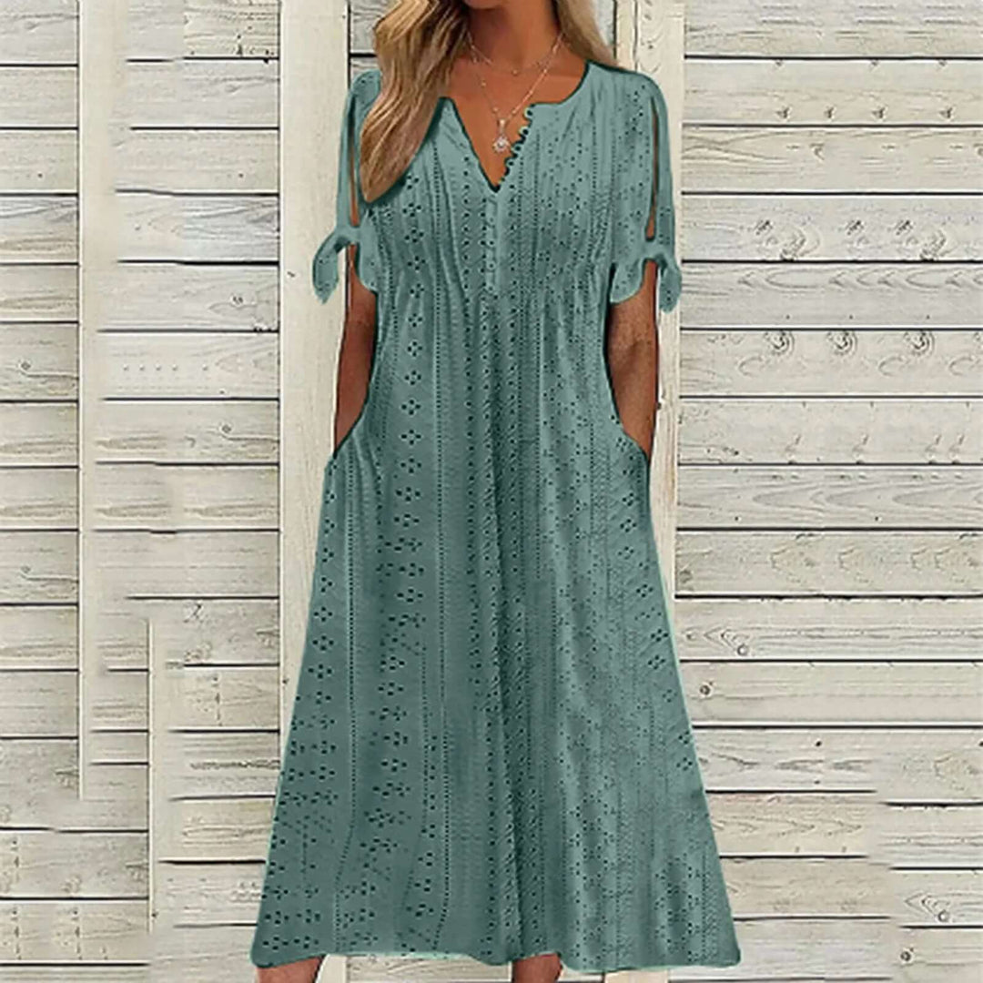 Versatile women's lace midi dress, suitable for elegant casual outings or a stylish party look. Comfortable polyester fabric.