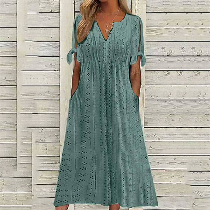 Versatile women's lace midi dress, suitable for elegant casual outings or a stylish party look. Comfortable polyester fabric.