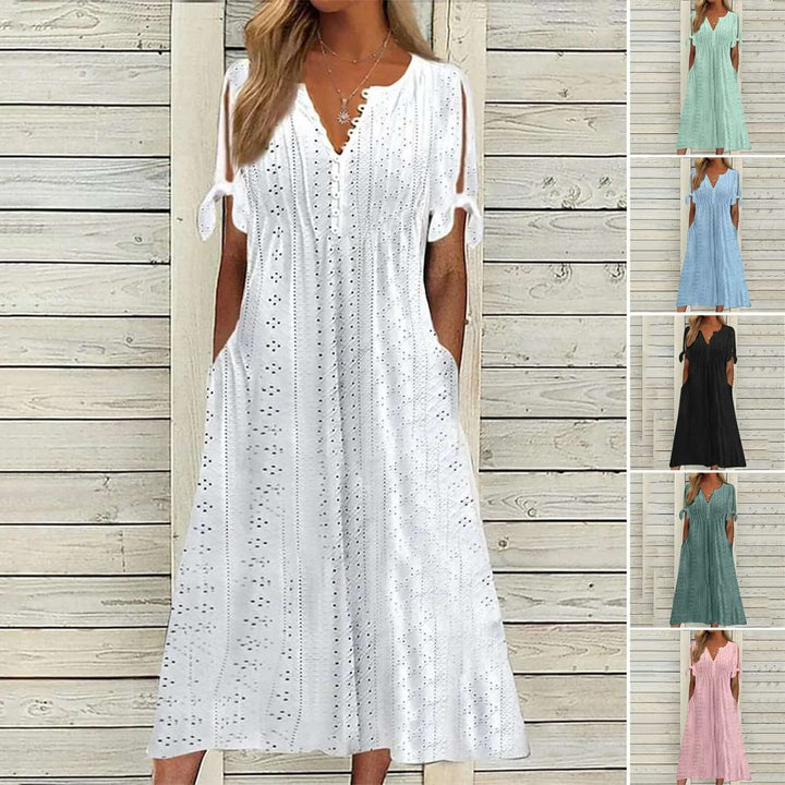 Women's elegant lace midi dress with beautiful details, a perfect blend of style and comfort for summer events.
