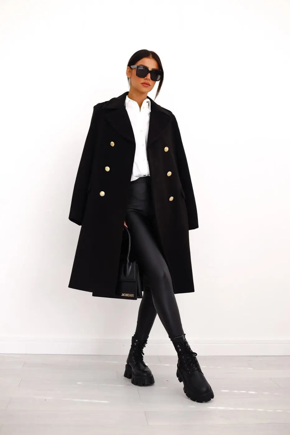 Elegant women's long double-breasted coat. Classic style for sophisticated winter fashion & outerwear.