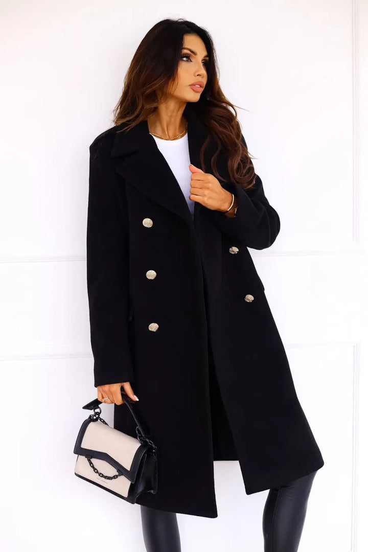 Classic double-breasted long coat for women, styled elegantly for professional or casual winter wear.