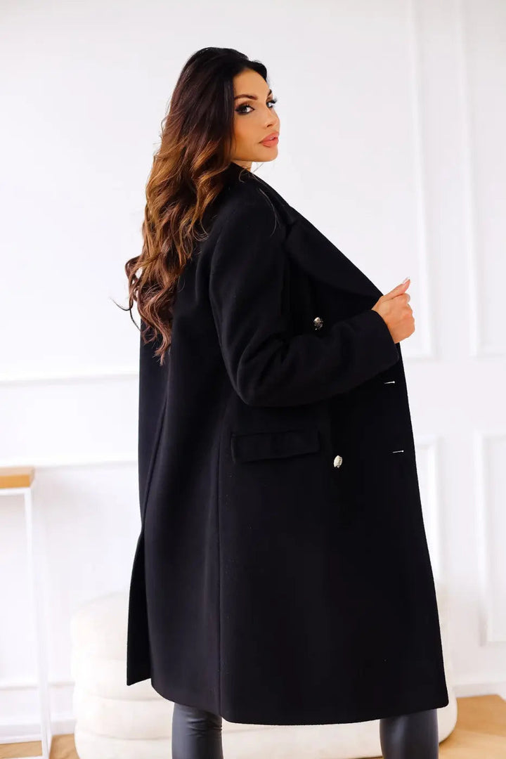Women's long double-breasted coat with classic buttons, a timeless & elegant winter outerwear piece.