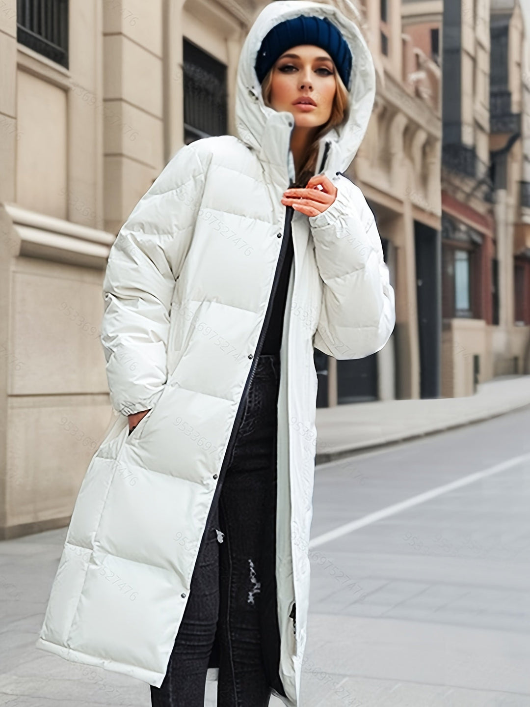 Elegant women's long down coat with hood, perfect for stylish winter outerwear.