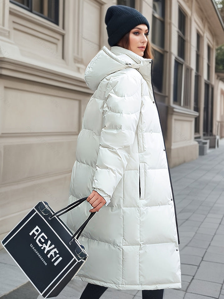 Chic women's hooded winter coat, a long down jacket for cold weather elegance and warmth.