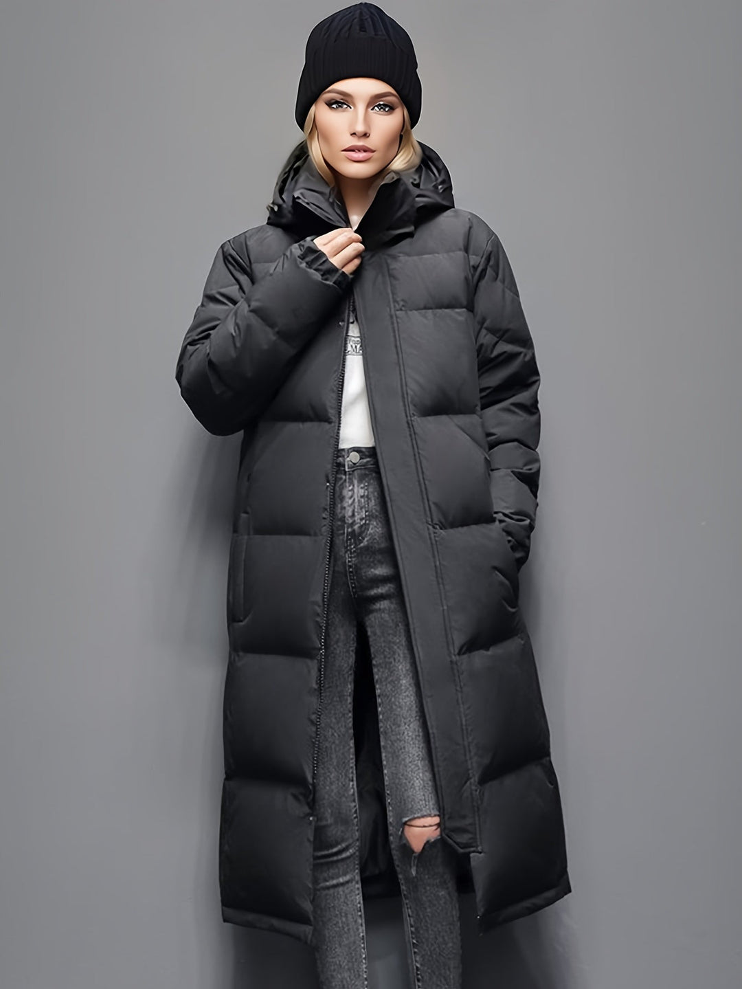 Premium women's elegant long down coat, a hooded winter jacket for severe cold weather protection.