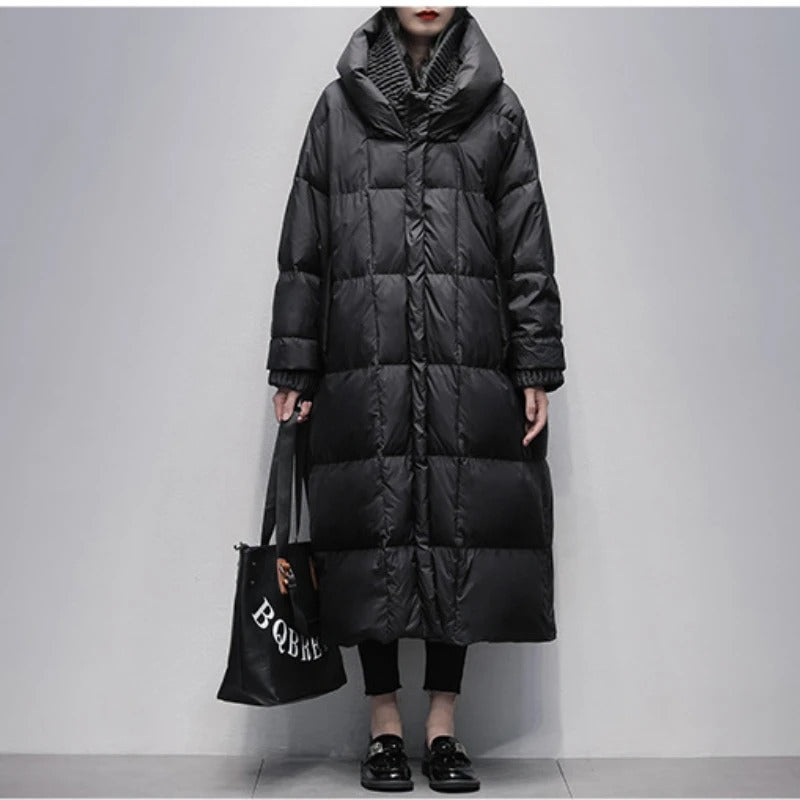 Elegant women's long padded winter jacket for stylish warmth in cold weather. Perfect outerwear.