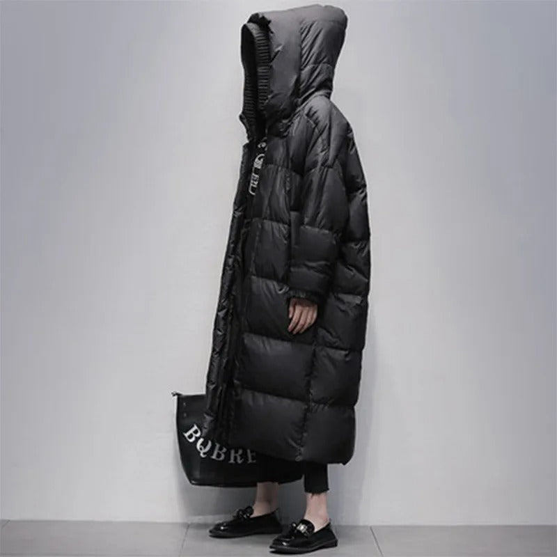 White women's elegant long padded winter coat, designed for ultimate warmth and fashion in cold weather.