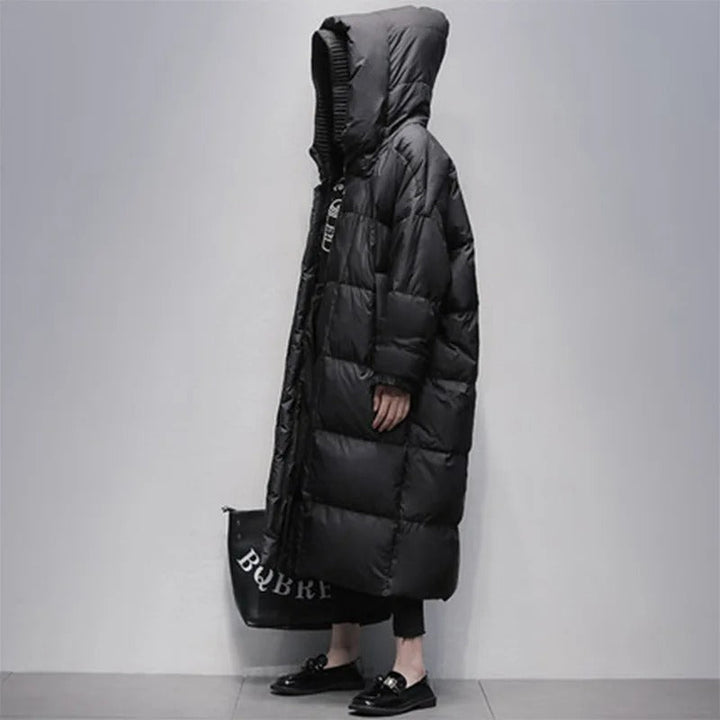 White women's elegant long padded winter coat, designed for ultimate warmth and fashion in cold weather.