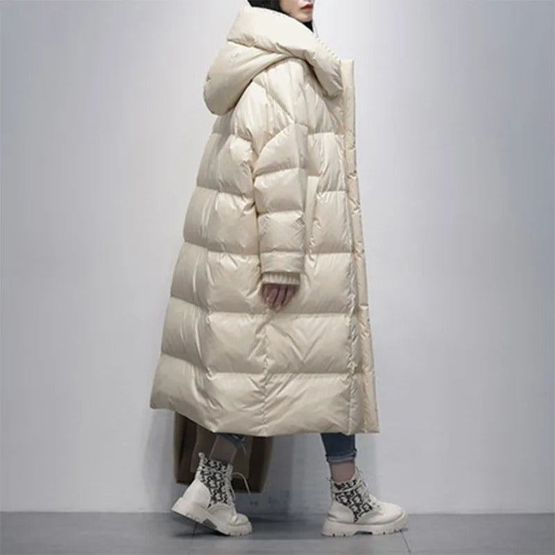 Cozy women's long padded winter jacket, offering elegant style and superior warmth for cold weather protection.