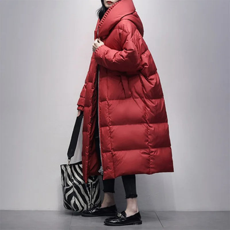 Fashionable women's long padded winter coat, ideal for elegant cold weather outfits and staying warm.