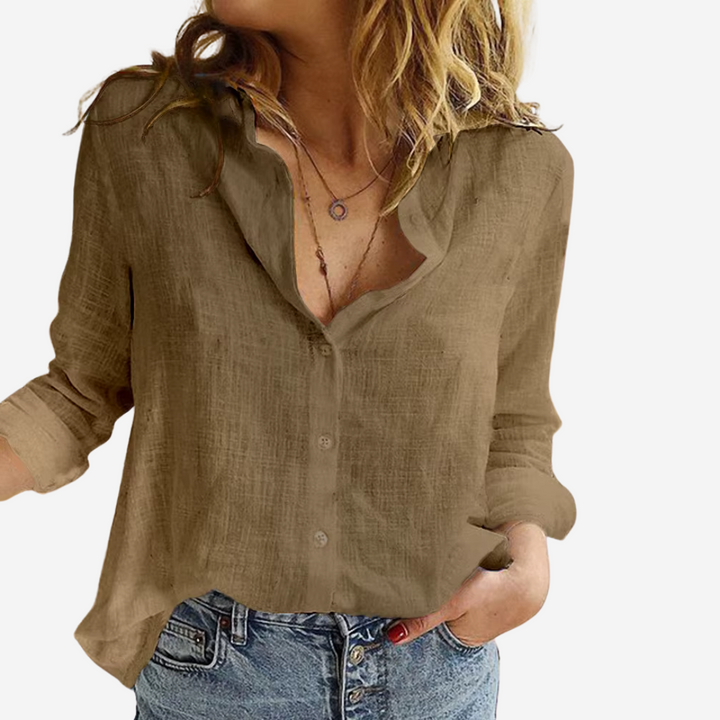Classic women's button-down blouse with long sleeves. Elegant, versatile, and comfortable for any season.