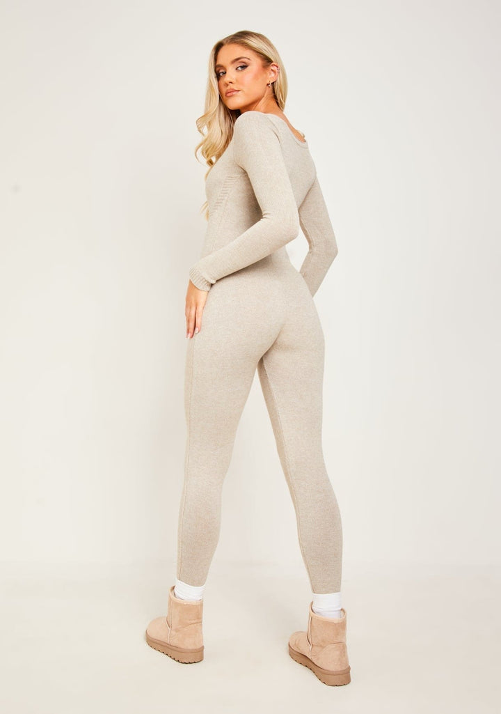 Stylish women's black long sleeve jumpsuit, a comfortable and elegant one-piece outfit for special occasions.