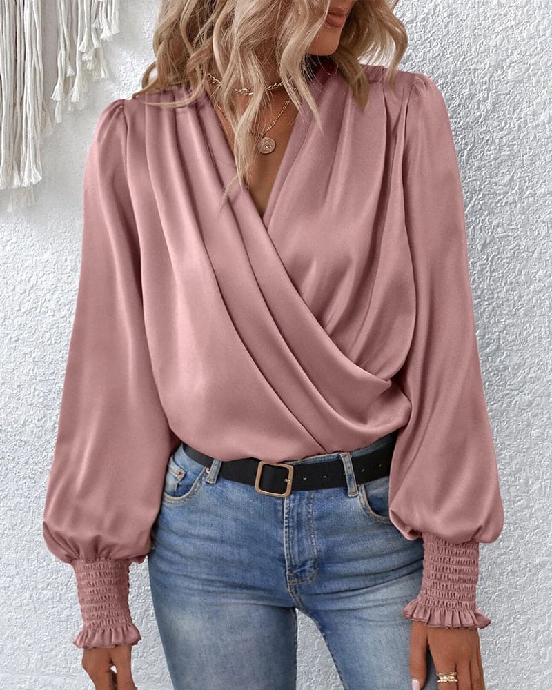 Stylish long-sleeve women's wrap blouse, offering an effortless, elegant look for any occasion.