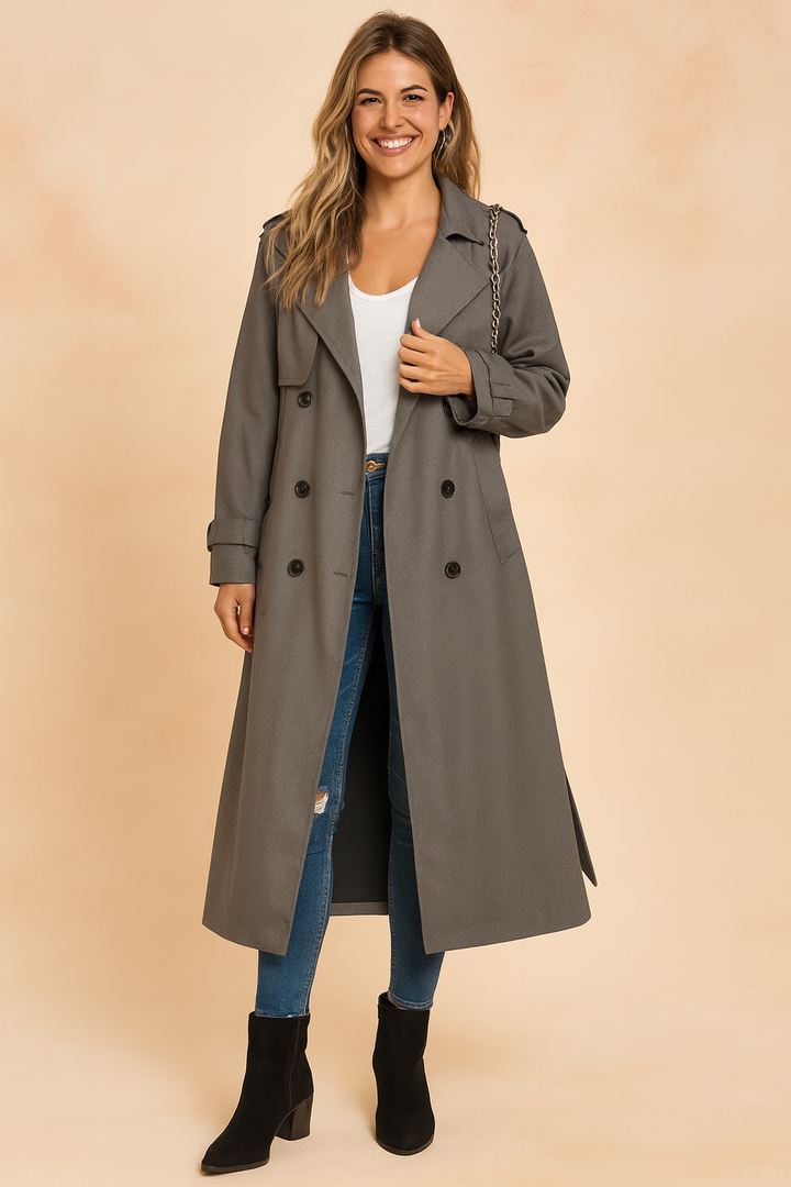 Chic women's long trench coat, elegant outerwear for timeless urban fashion. A classic double-breasted winter jacket.